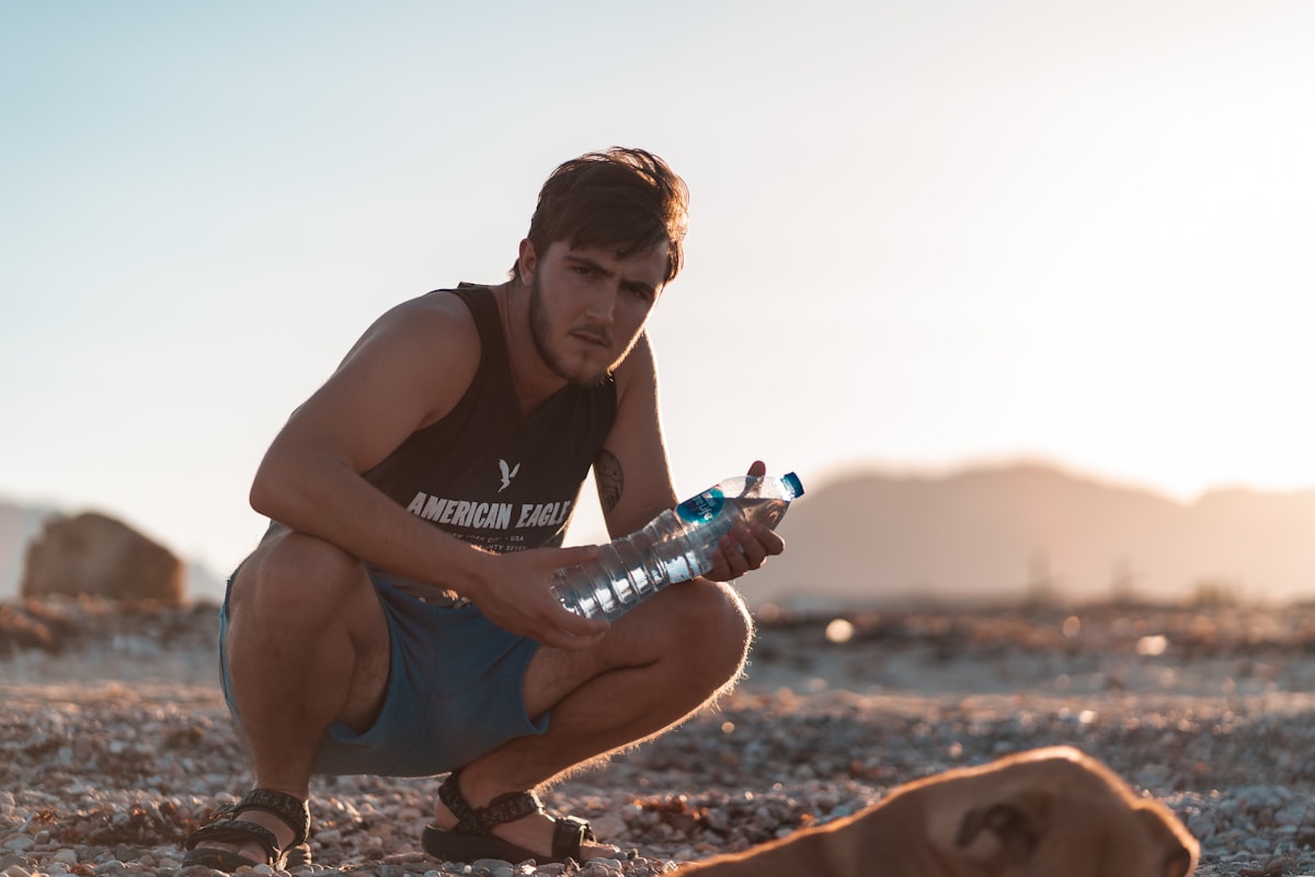 Expert trainer demonstrating supplement use for men